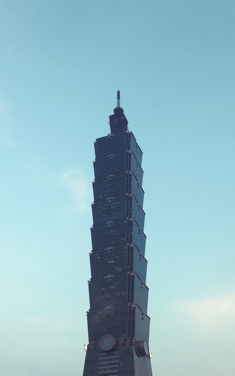 LOW ANGLE VIEW OF MODERN BUILDING AGAINST CLEAR BLUE SKY