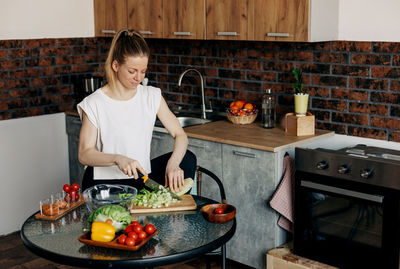 Sports woman cooking healthy eat at home