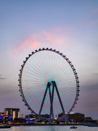 Low angle view of ferris wheel against sky