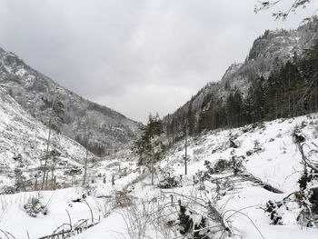 Scenic view of snow covered mountains against sky