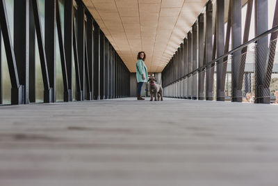 Man walking on footbridge