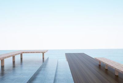 Pier over sea against clear sky