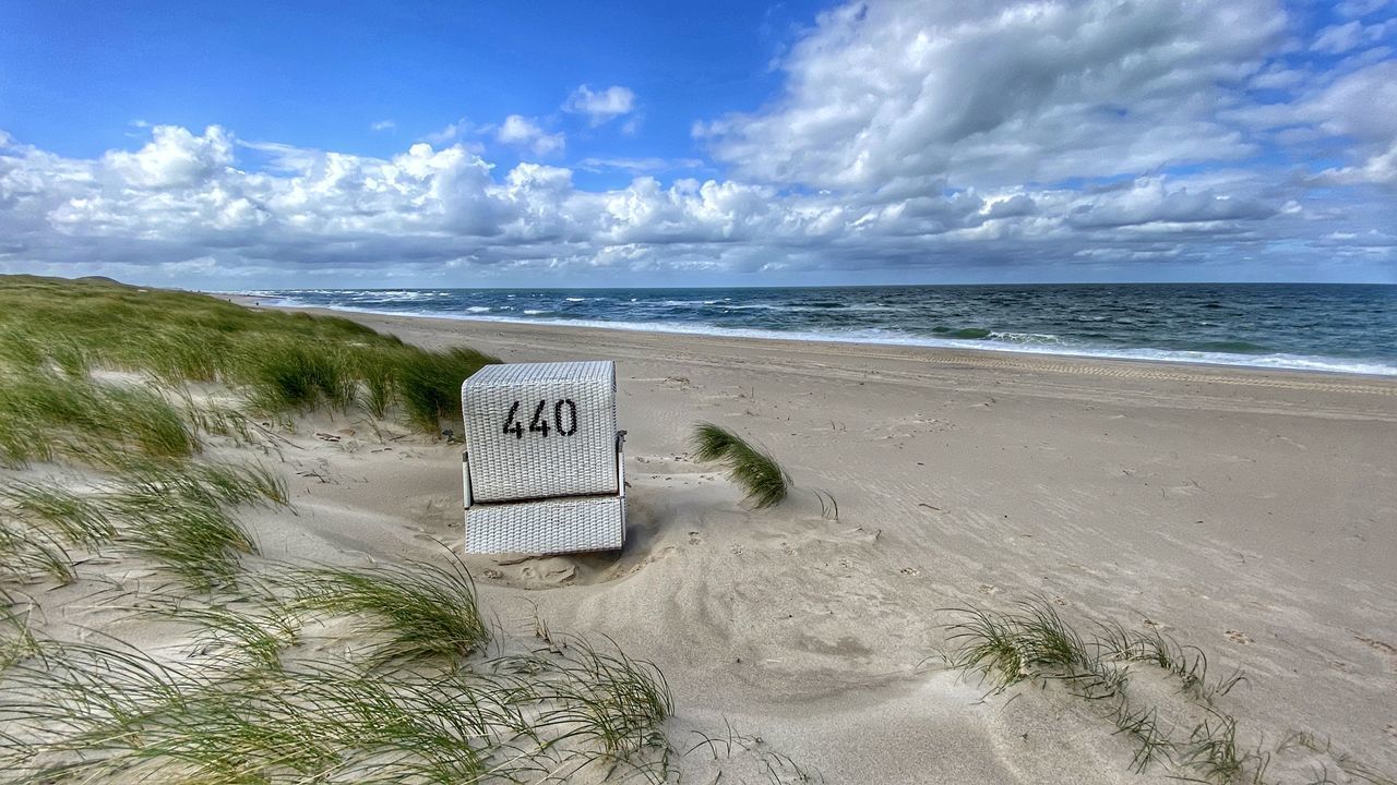 LIFEGUARD HUT ON SHORE AGAINST SKY