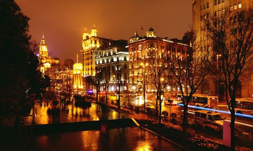 Reflection of illuminated street lights in city at night