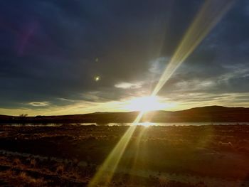 Scenic view of landscape against sky during sunset