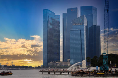 Modern buildings in city at sunset