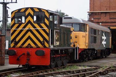 Train on railroad track against sky