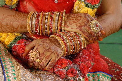 Midsection of bride at wedding ceremony