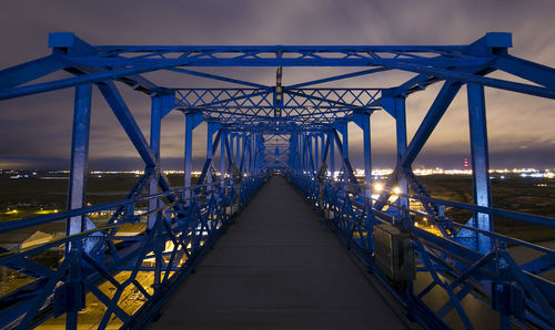 Suspension bridge against sky in city