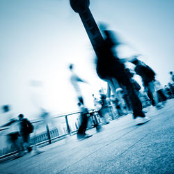 People walking on street in city