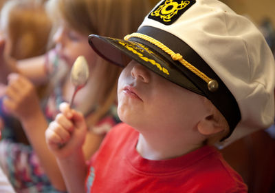 Close-up of boy wearing hat