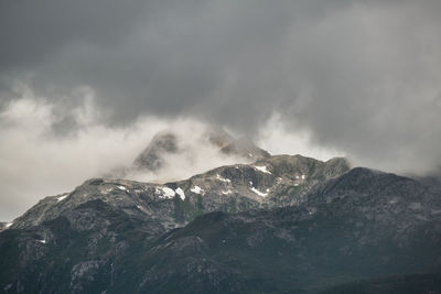 Low angle view of snowcapped mountain against sky