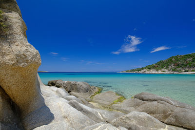 Scenic view of sea against blue sky