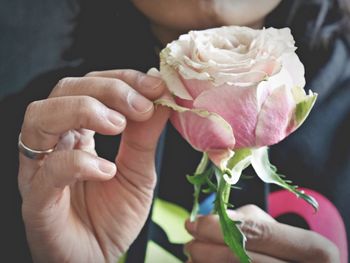 Close-up of woman holding rose bouquet