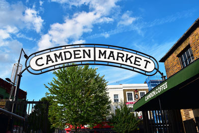 Low angle view of information sign against building