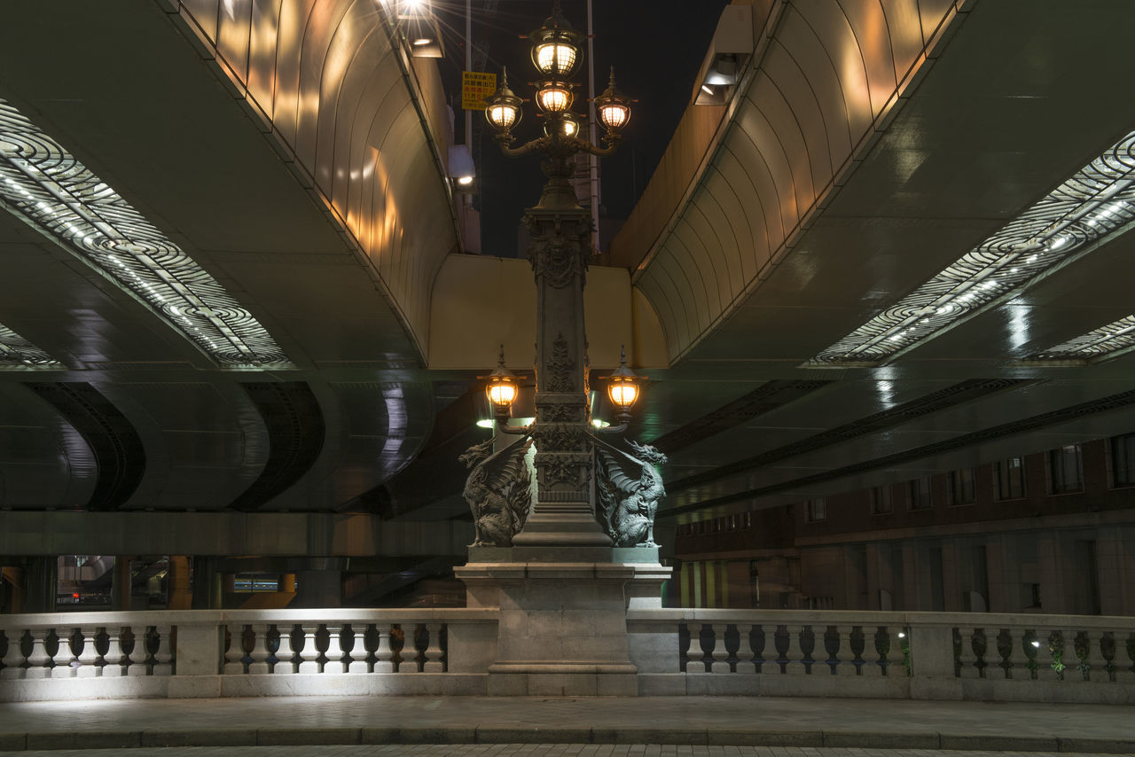 LOW ANGLE VIEW OF ILLUMINATED CEILING OF BUILDING