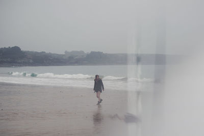 Full length of man walking on beach