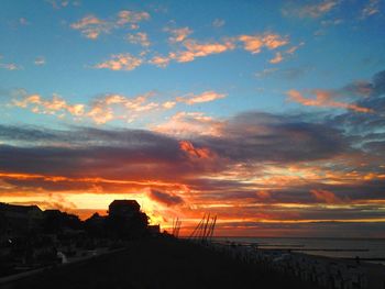 Scenic view of beach against sky during sunset