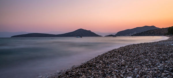 Scenic view of sea against clear sky during sunset