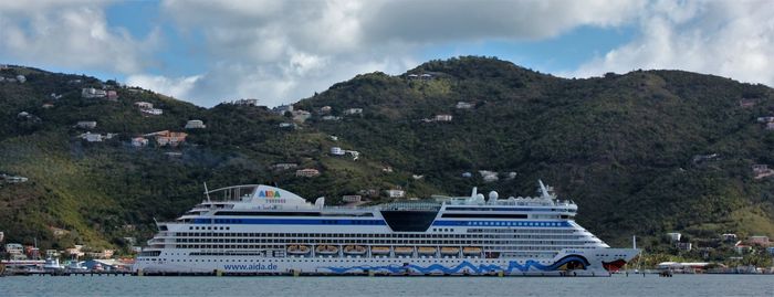 Panoramic view of cruise ship with sea against sky