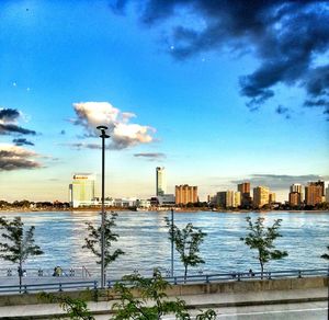 View of cityscape against blue sky