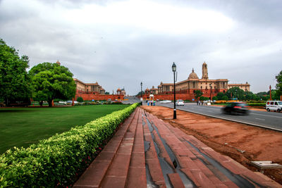 View of buildings against cloudy sky