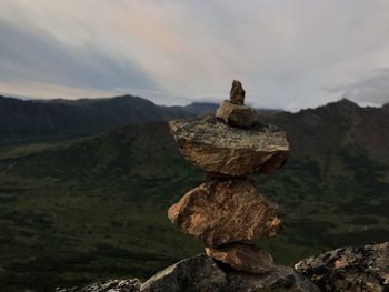 Rockstacking while hiking to the top of flattop 