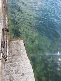 High angle view of rock by lake