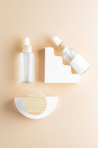 Trendy background with natural cosmetic skincare bottles. product presentation. beauty and body care