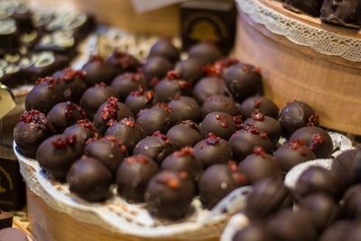 Close-up of chocolate balls served in plate at table