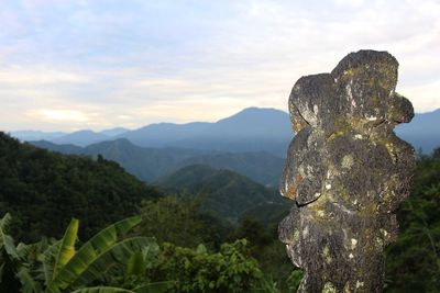 Scenic view of rock against sky