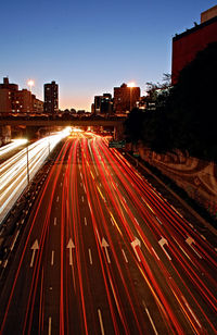 High angle view of light trails on city at night