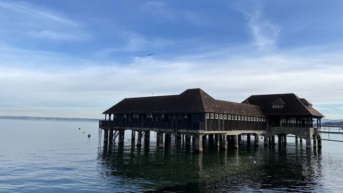 House by sea against sky