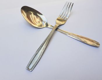 High angle view of electric lamp on table against white background