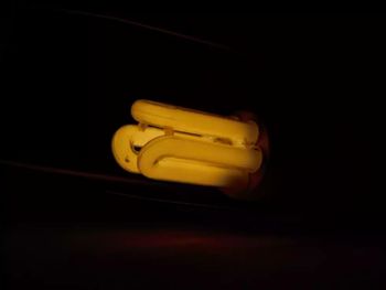 Close-up of yellow buttons against black background