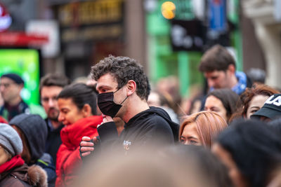 Group of people photographing in city