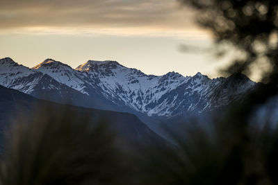 Snowy mountain ridge and alpine landscape, at sunset in new zealand