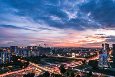 High angle view of illuminated cityscape at night