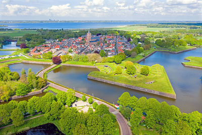 High angle view of plants and river against sky