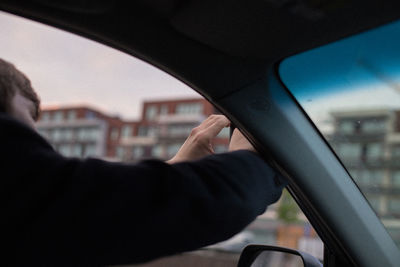 Close-up of man hand holding car