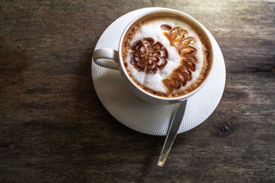 High angle view of cappuccino on table