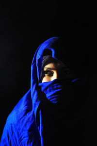 Portrait of woman in darkroom