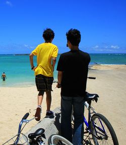 Rear view of people on beach