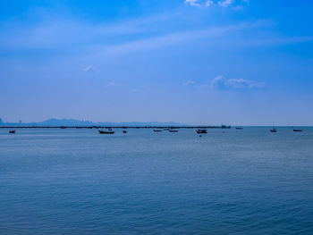 Scenic view of sea against blue sky