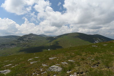 Scenic view of landscape and mountains against sky