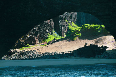 Scenic view of sea seen through cave