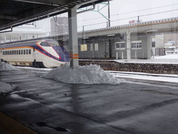 Train on snow covered railroad tracks in winter