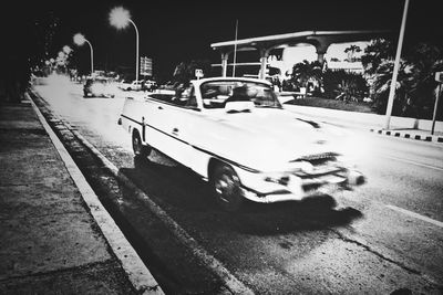 Cars on road at night