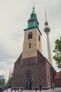 Clock tower against sky in city