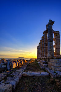 Old building against blue sky during sunset